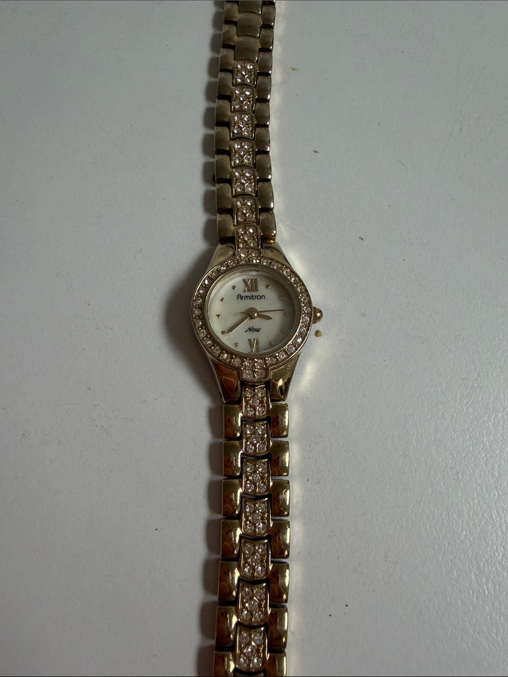 Armitron Gold Tone Crystal Bracelet Ladies Watch with White Dial needs battery